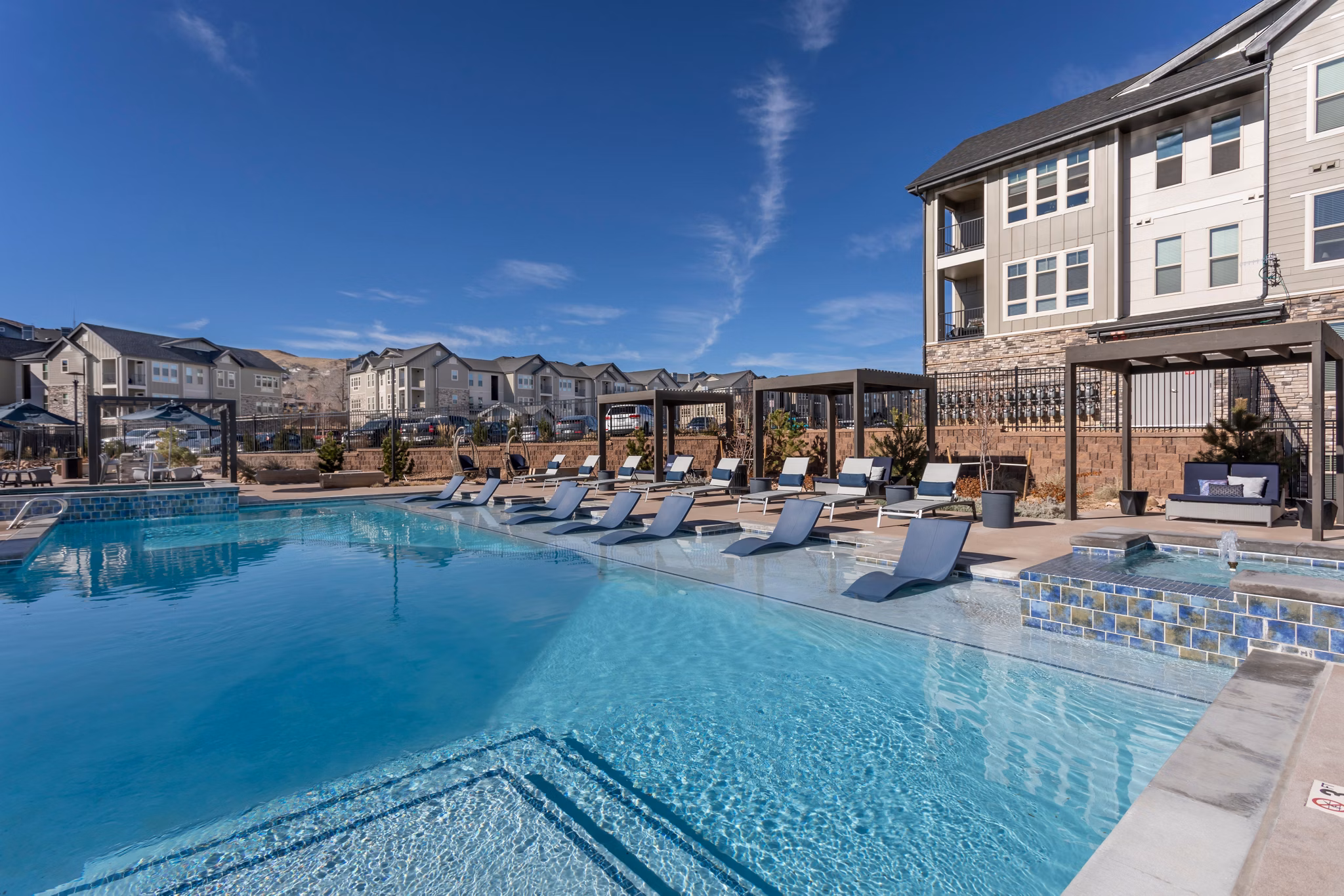 Alta Green Mountain Apartments: Luxurious pool with mountain views in a serene setting