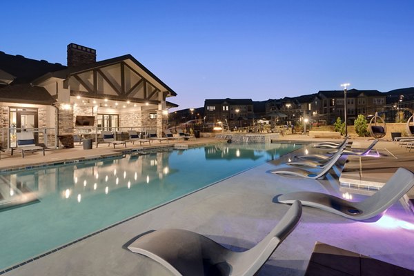 Luxurious pool area with mountain views at Alta Green Mountain Apartments