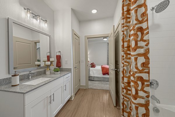 Luxurious bathroom featuring sleek modern fixtures at Alta Landing Apartments