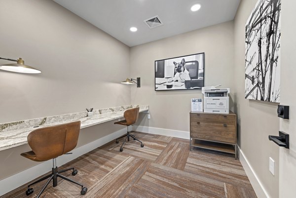 Clubhouse featuring modern furnishings and social spaces at Alta Landing Apartments