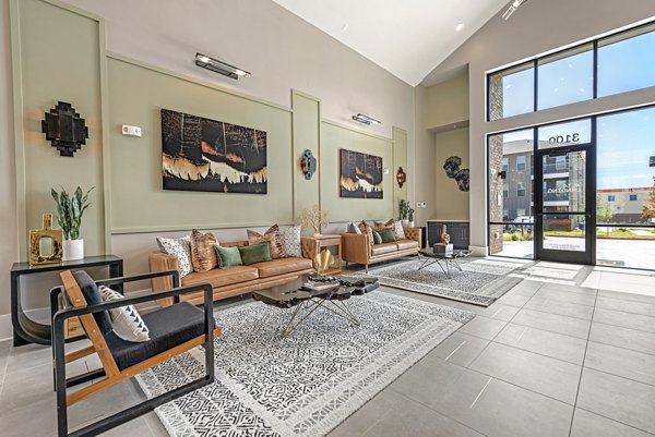 Clubhouse featuring modern design and co-working spaces at Alta Landing Apartments
