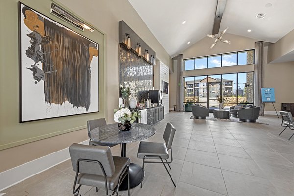 Clubhouse with modern design and ample seating at Alta Landing Apartments