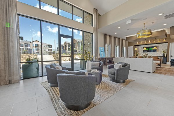 Chic clubhouse with modern seating and decor at Alta Landing Apartments