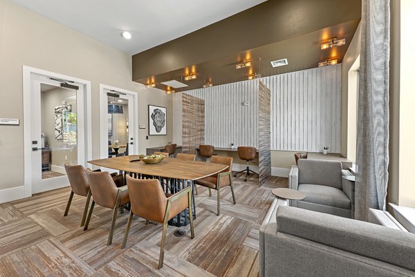 Clubhouse featuring modern design and comfortable seating at Alta Landing Apartments, ideal for community gatherings