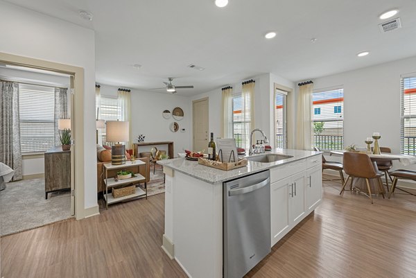 Modern kitchen featuring stainless steel appliances in Alta Landing Apartments