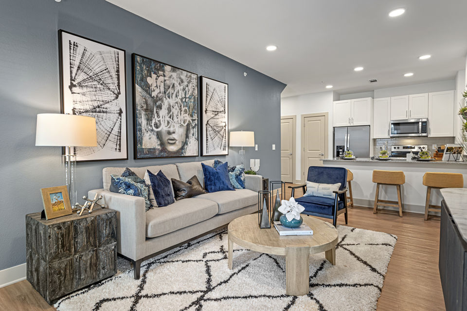Cozy living room with modern decor at Alta Landing Apartments, featuring a comfortable seating area and stylish furniture setup