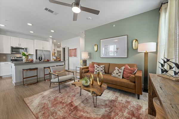 Comfortable living room with modern decor at Alta Landing Apartments, offering luxury living spaces in a vibrant community
