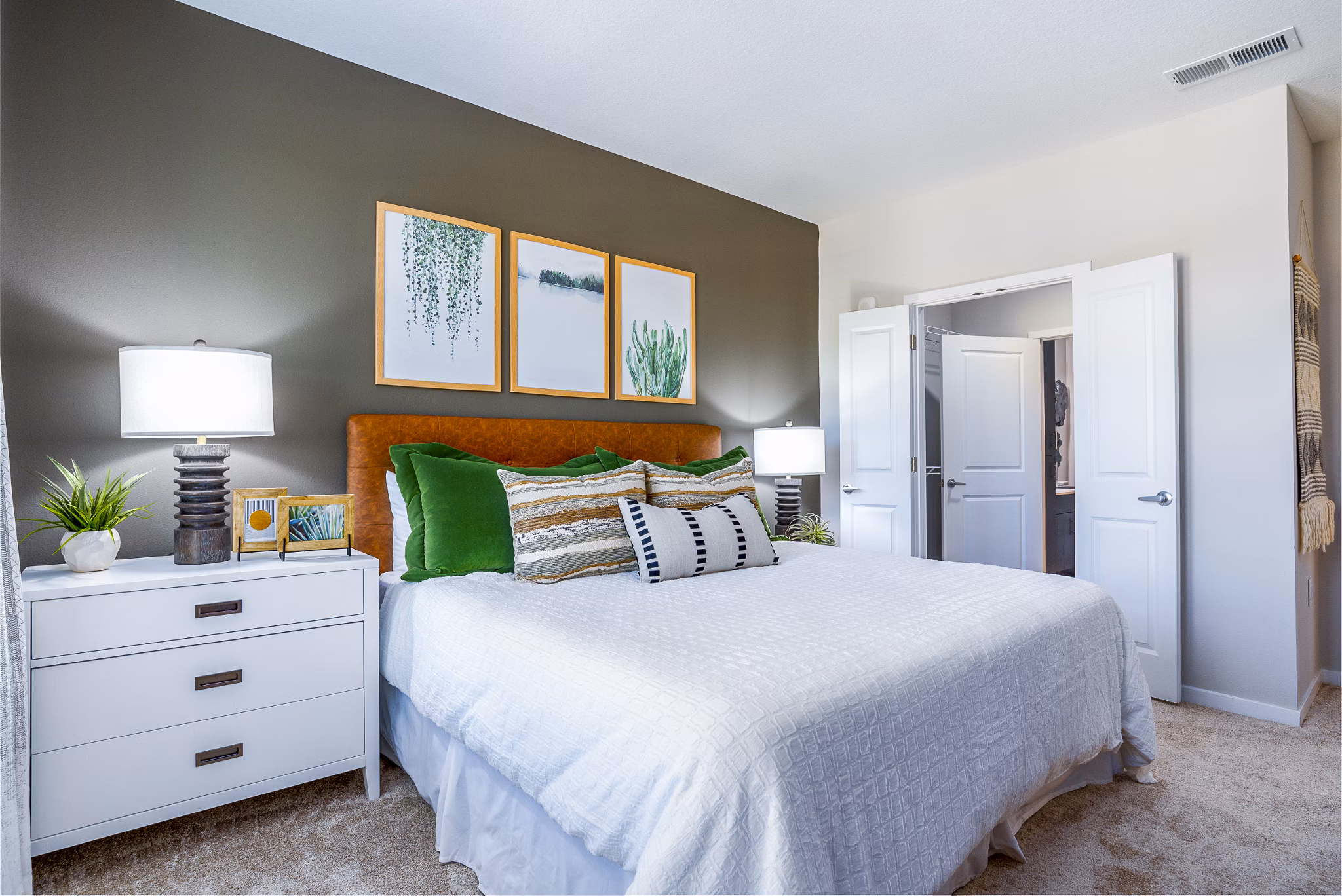 Luxurious bedroom with contemporary furnishings at Alta Longwood Apartments