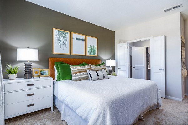 Luxurious bedroom with contemporary furnishings at Alta Longwood Apartments
