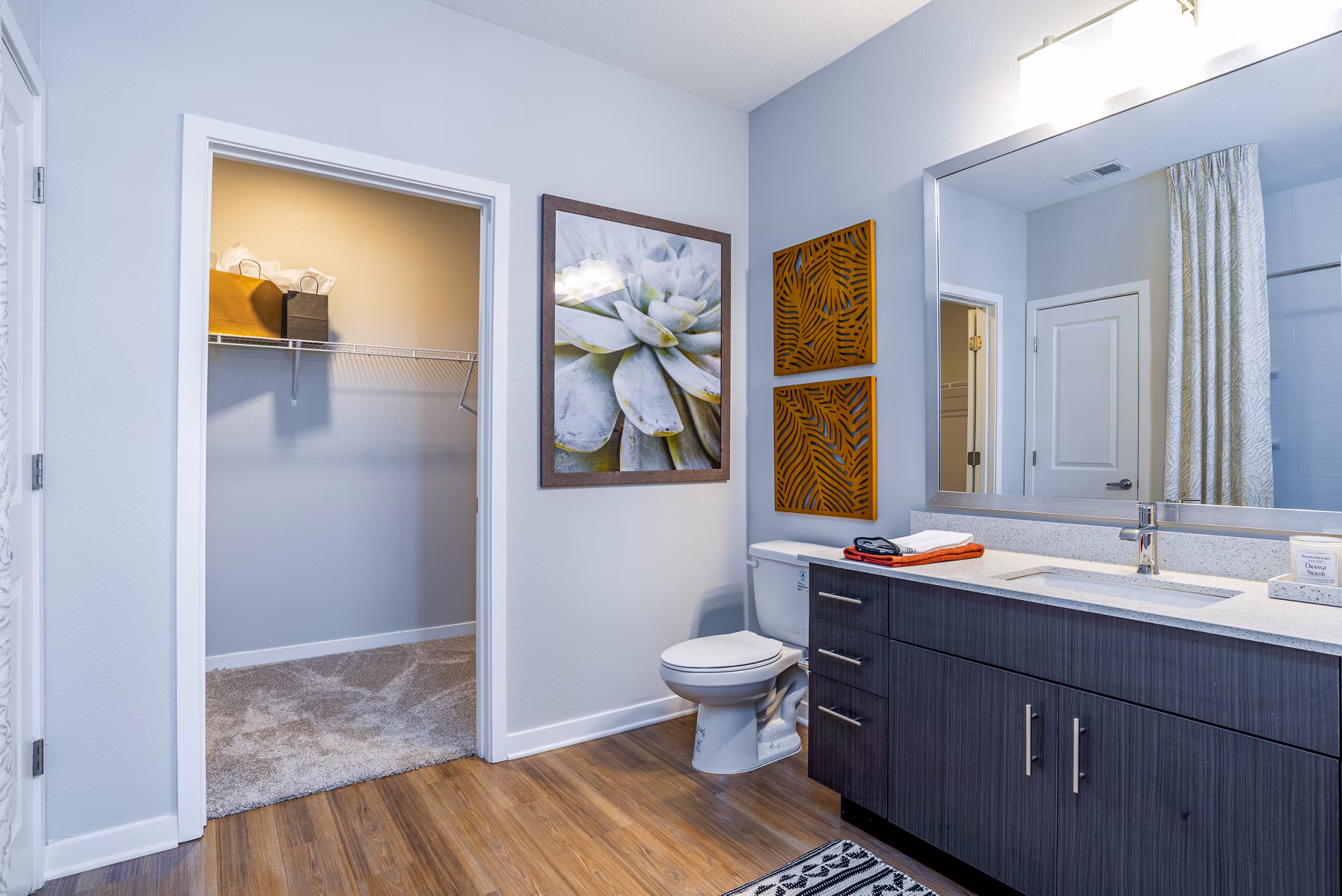 Modern bathroom with elegant vanity and glass shower in Alta Longwood Apartments luxury apartments