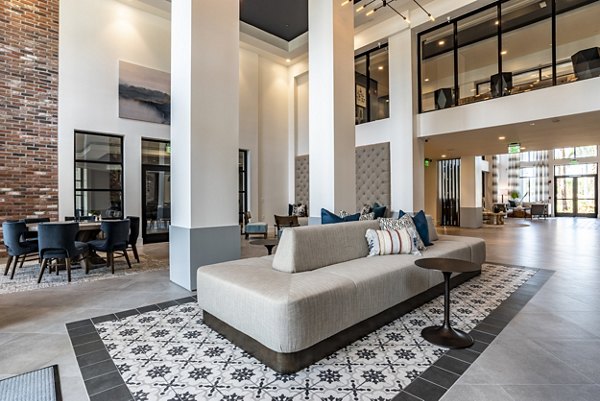 Luxury clubhouse with modern design at Alta Longwood Apartments offering an inviting space for socializing and relaxation