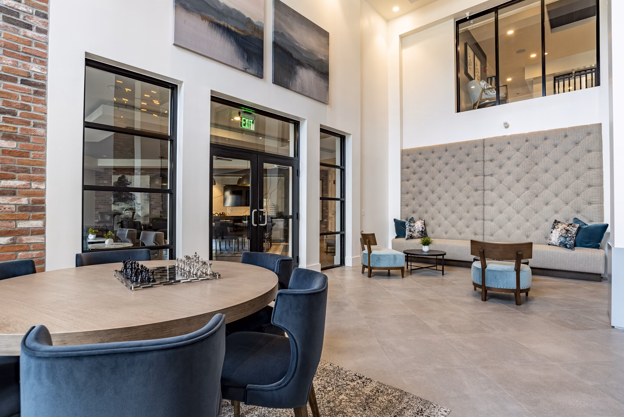 Clubhouse lounge with modern seating and decor at Alta Longwood Apartments
