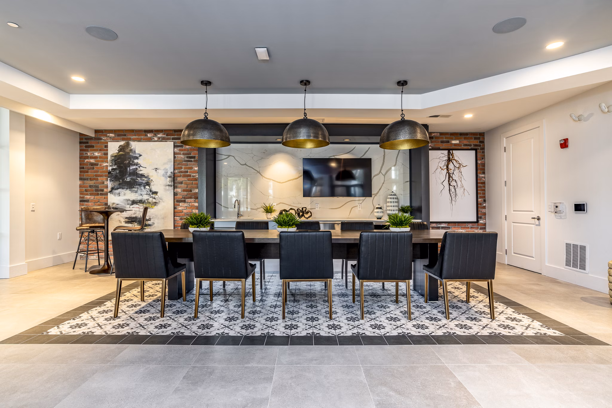 Elegant clubhouse in Alta Longwood Apartments with modern lounge seating and ambient lighting