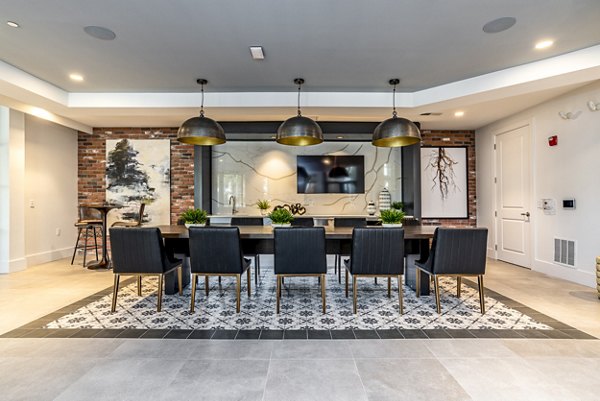 Elegant clubhouse in Alta Longwood Apartments with modern lounge seating and ambient lighting