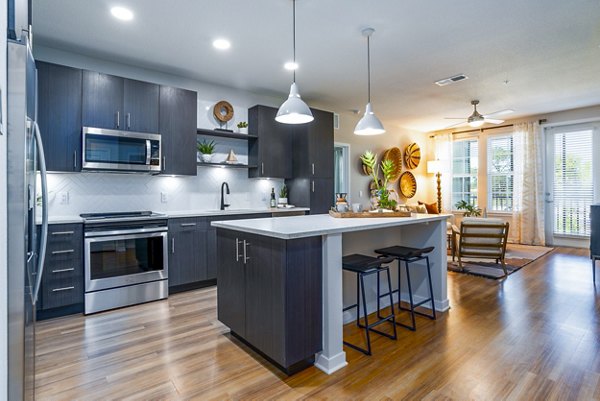 Spacious kitchen featuring modern appliances at Alta Longwood Apartments