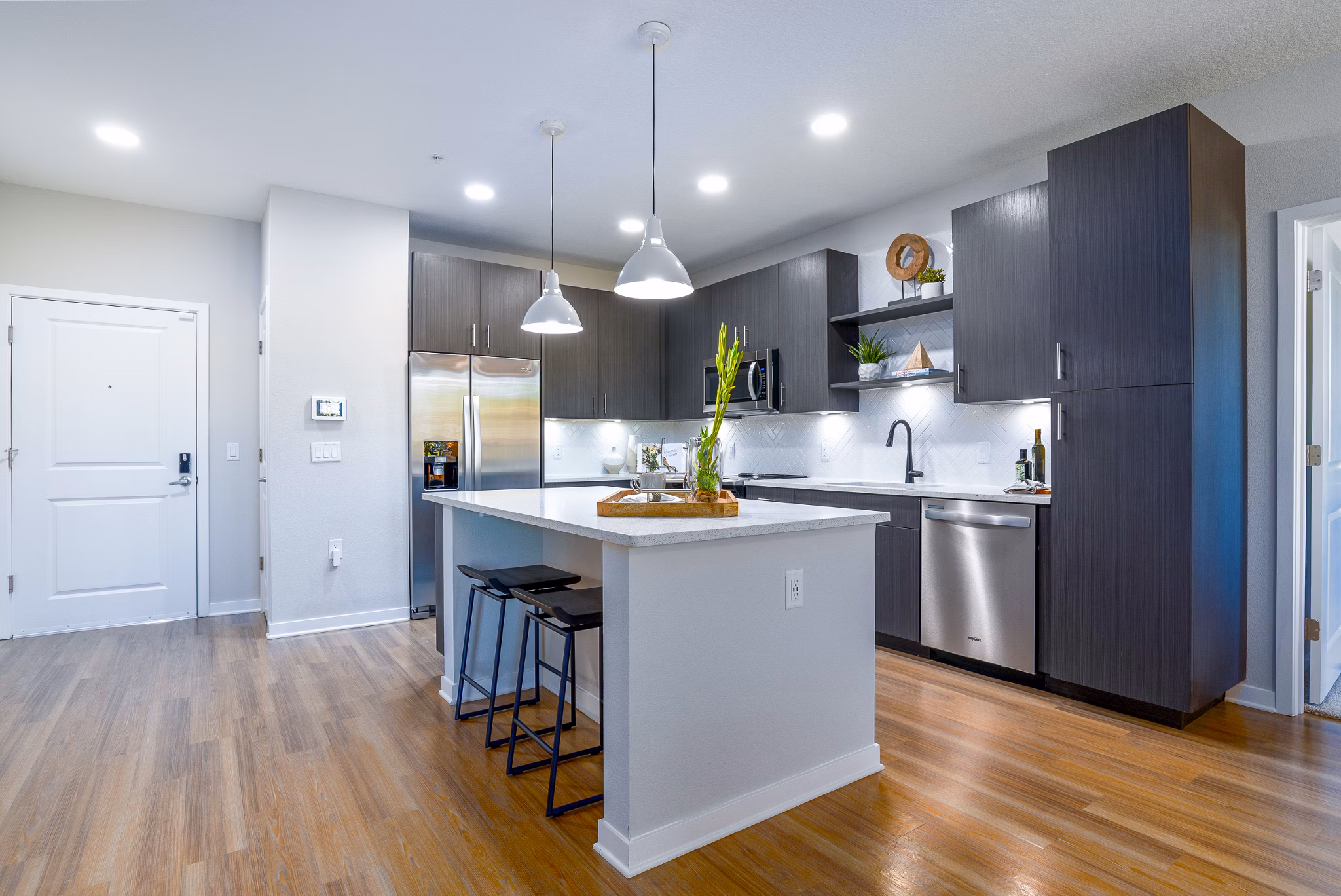 Sleek kitchen with stainless steel appliances at Alta Longwood Apartments