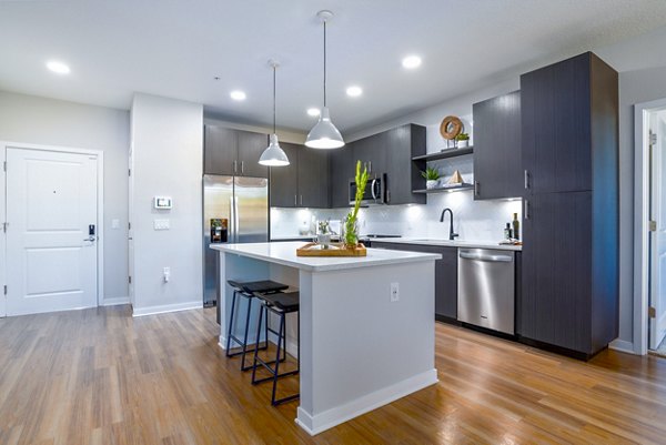 Sleek kitchen with stainless steel appliances at Alta Longwood Apartments