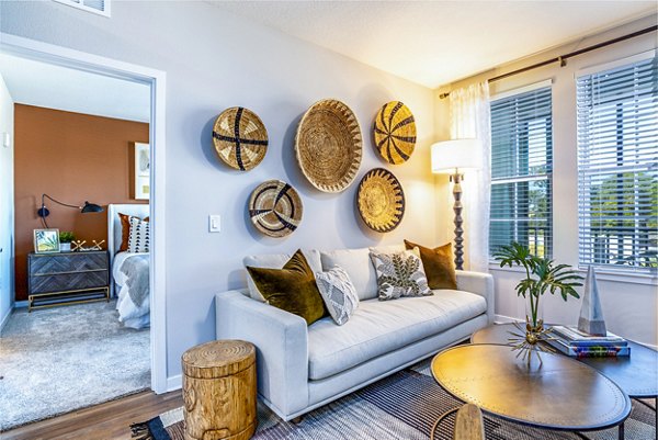 Spacious living room with modern decor and natural light at Alta Longwood Apartments