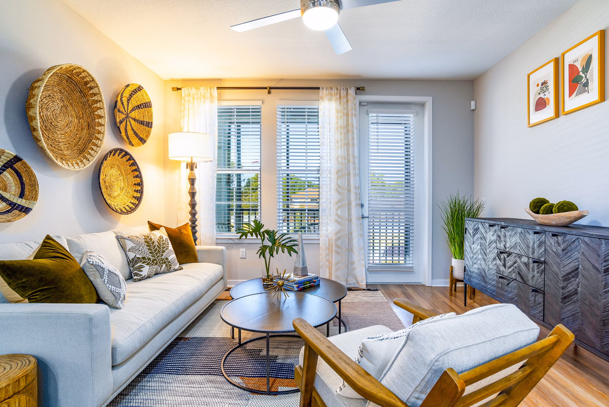 Spacious living room with modern furnishings in Alta Longwood Apartments