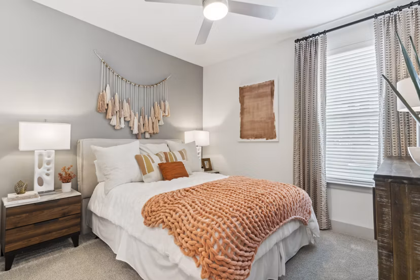 Modern bedroom with elegant decor at Alta Marine Creek Apartments, featuring a spacious layout and stylish furniture