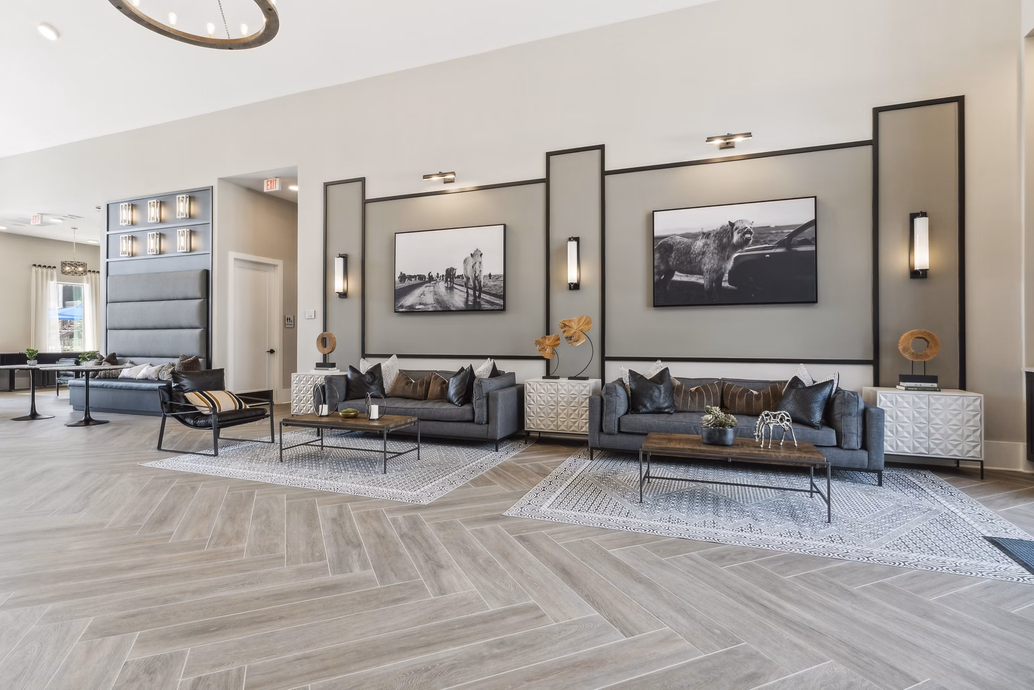 Clubhouse featuring modern design and ample seating at Alta Marine Creek Apartments, a luxury community offering premium amenities