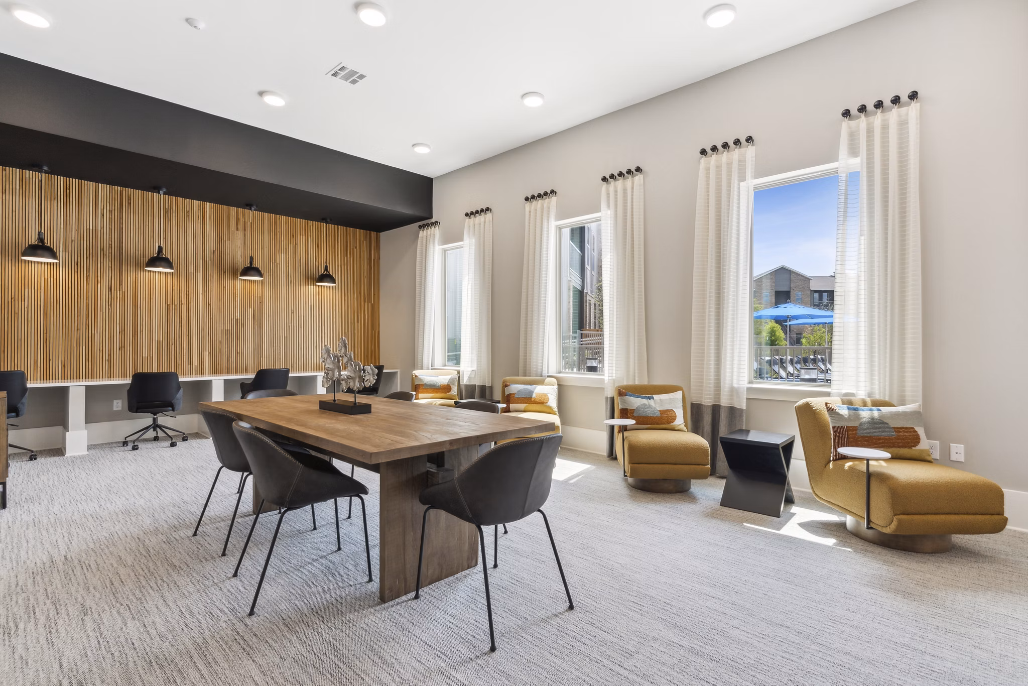 Clubhouse featuring modern design and lounge areas at Alta Marine Creek Apartments