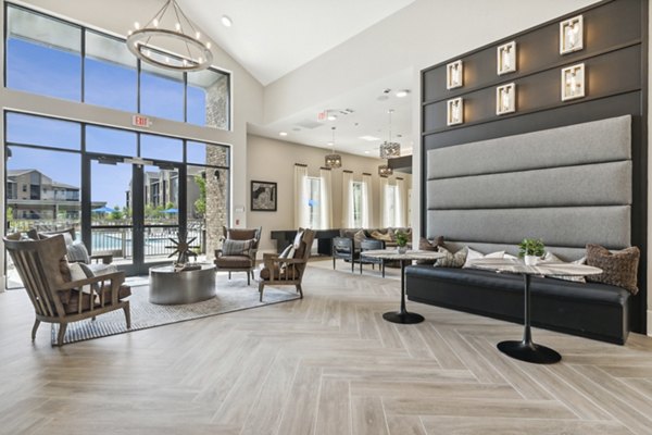 Modern clubhouse featuring stylish lounge area at Alta Marine Creek Apartments