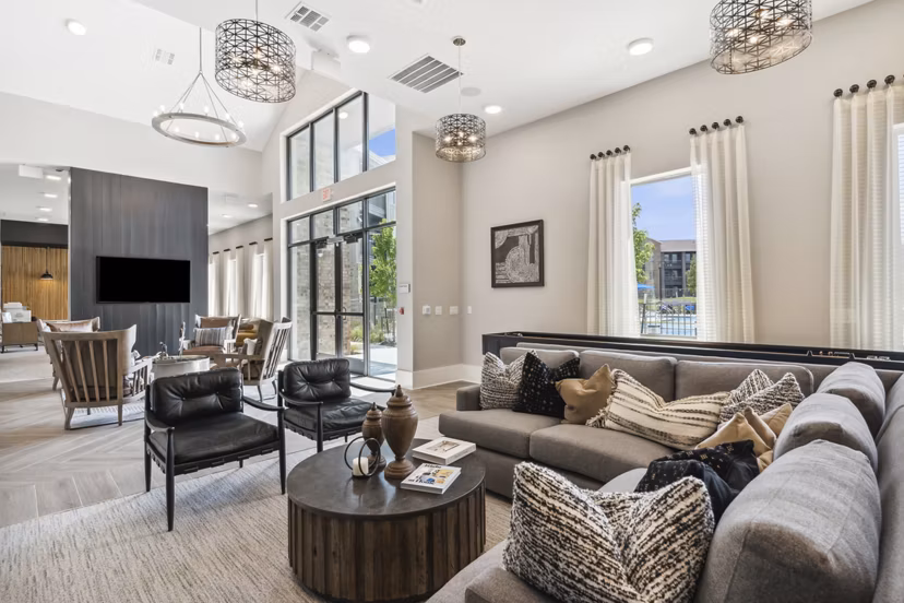 Clubhouse at Alta Marine Creek Apartments featuring modern design and seating areas