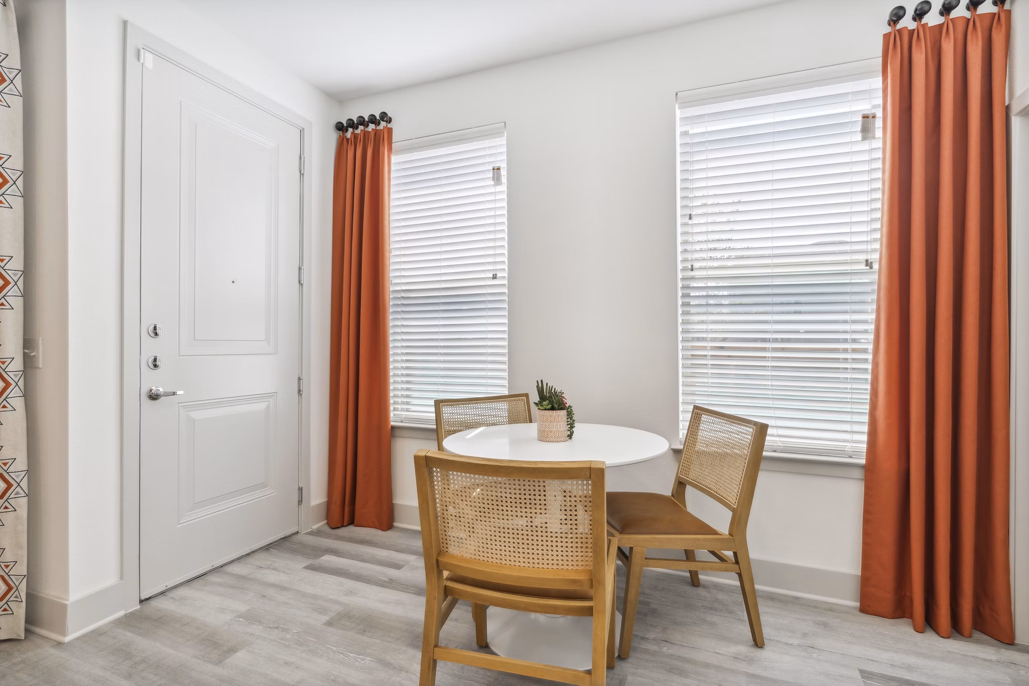 Dining room with modern furnishings and elegant lighting at Alta Marine Creek Apartments