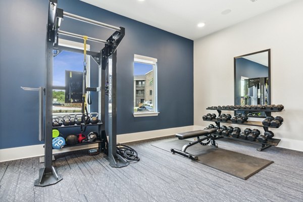 Modern fitness center with state-of-the-art equipment at Alta Marine Creek Apartments