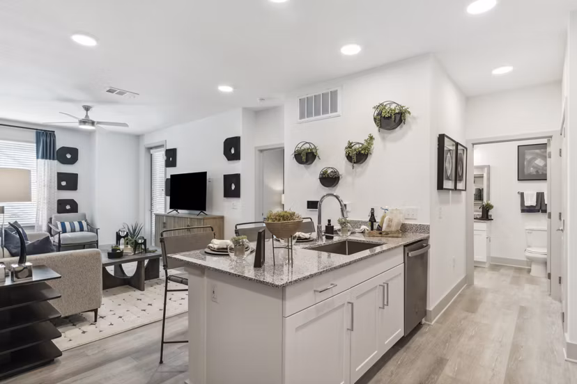 Modern kitchen with stainless steel appliances in Alta Marine Creek Apartments