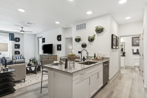 Modern kitchen with stainless steel appliances in Alta Marine Creek Apartments