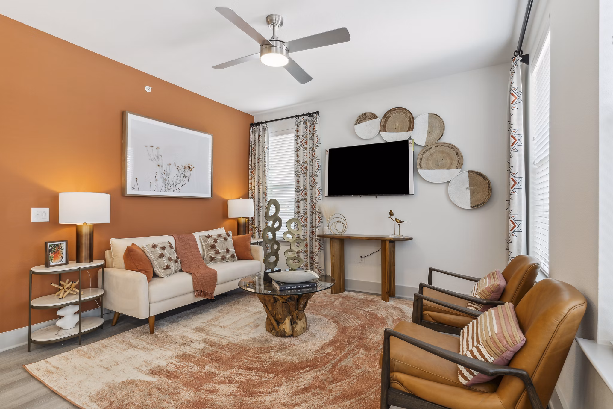 Spacious living room with modern decor and large windows in Alta Marine Creek Apartments