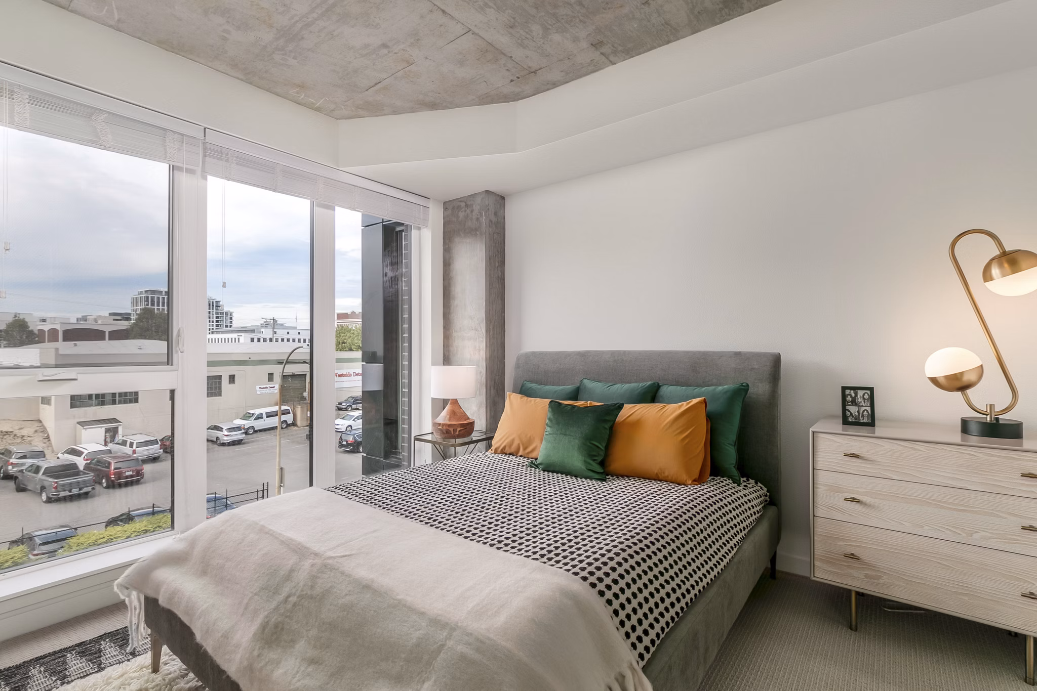Luxurious bedroom with mountain views at Alta Peak Apartments offering comfort and style for residents seeking upscale living