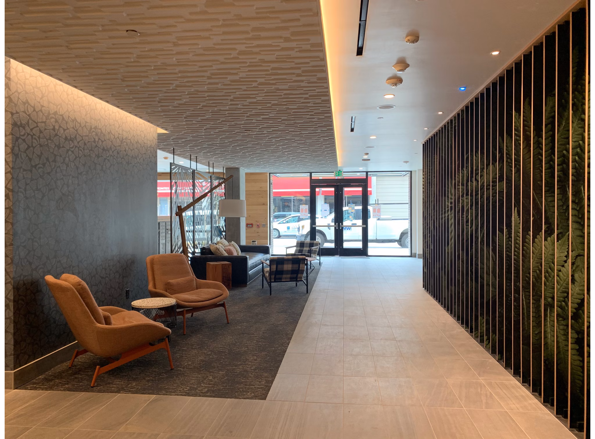Clubhouse featuring modern design and seating areas at Alta Peak Apartments