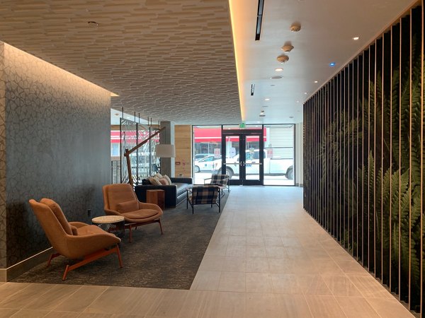 Clubhouse featuring modern design and seating areas at Alta Peak Apartments