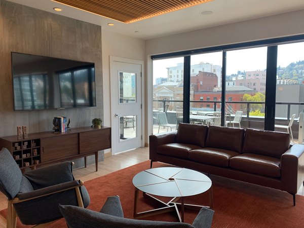 Clubhouse featuring modern design and lounge seating in Alta Peak Apartments