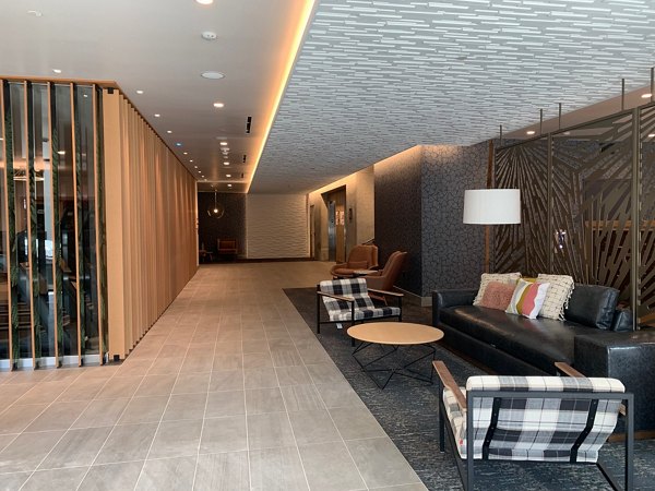 Clubhouse with modern decor and cozy seating at Alta Peak Apartments, a luxury living community