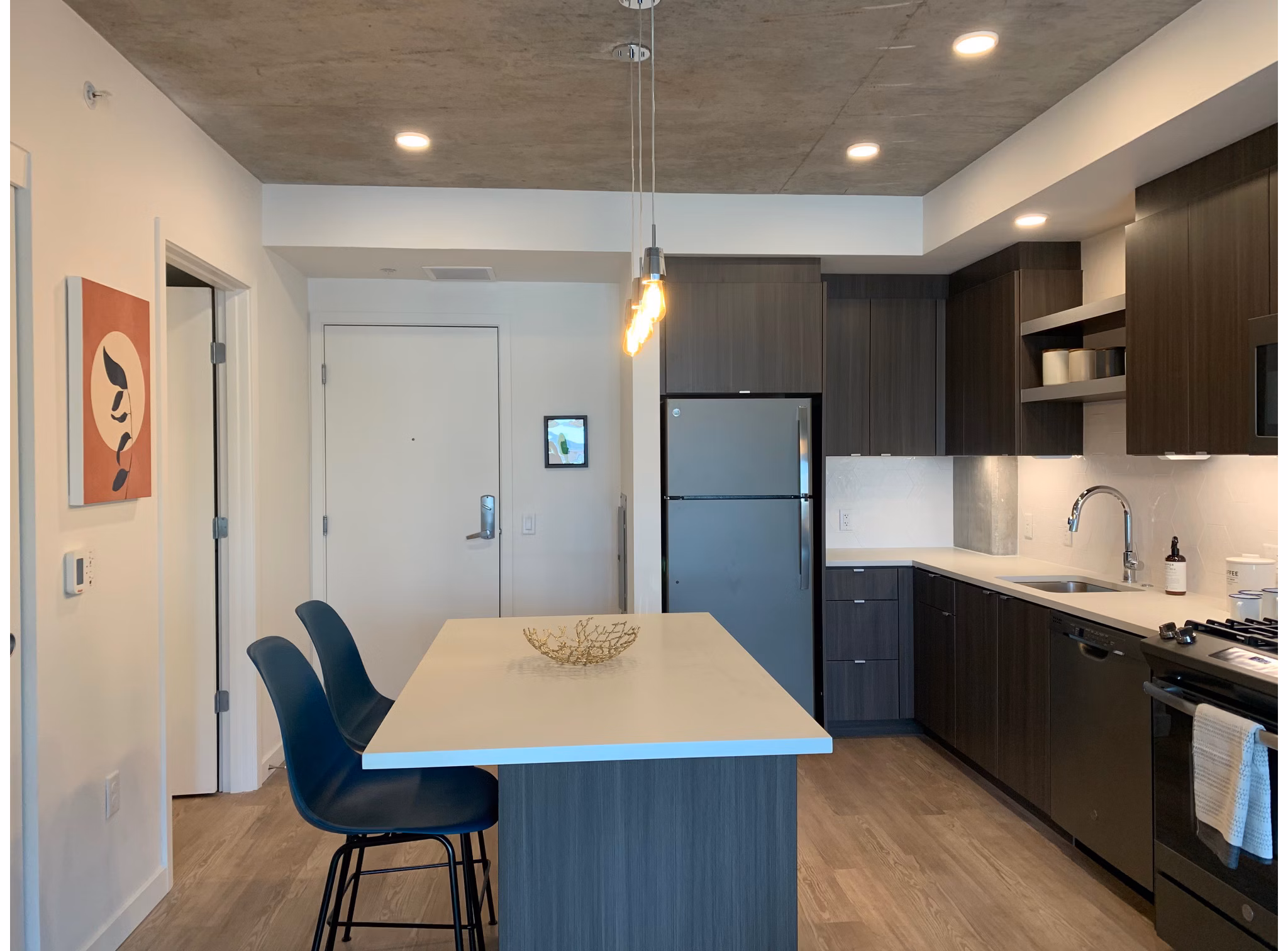 Modern kitchen with stainless steel appliances at Alta Peak Apartments