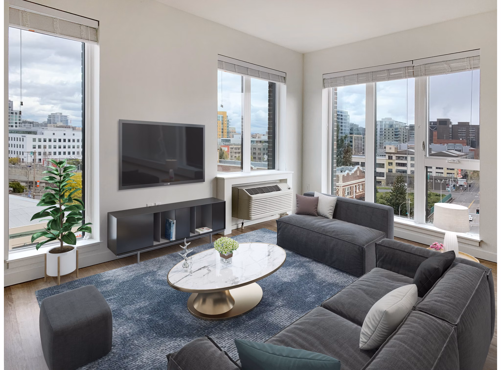 Living room with modern furnishings at Alta Peak Apartments, Greystar luxury community
