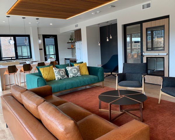 Modern rooftop lounge with mountain views at Alta Peak Apartments