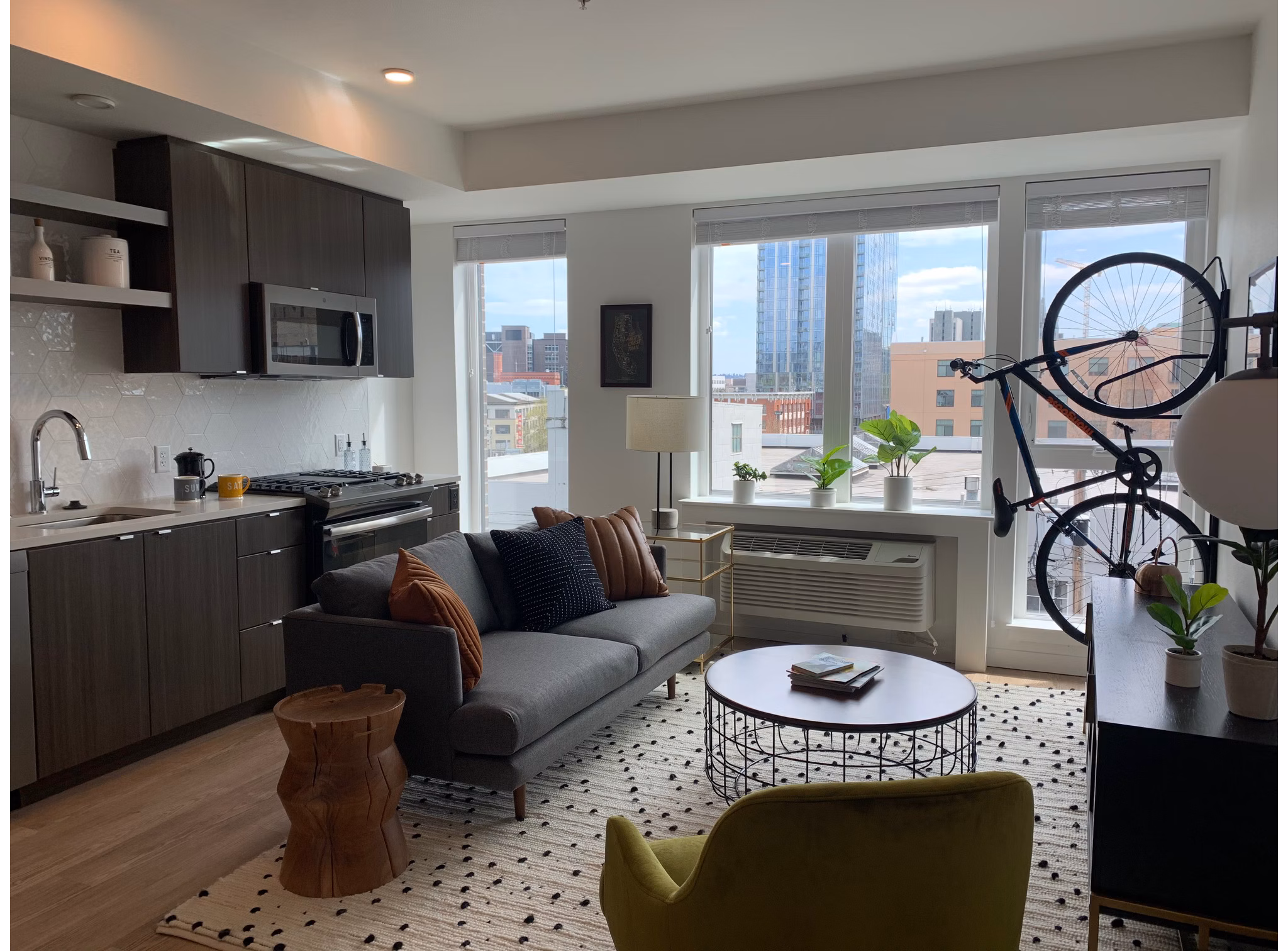 Spacious living room with mountain views in Alta Peak Apartments, luxury property by Greystar