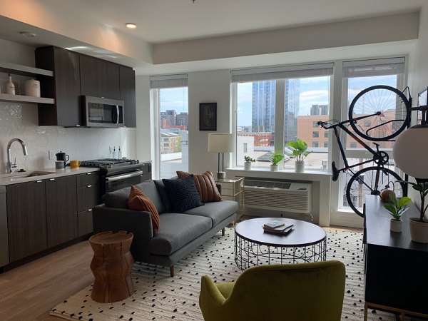 Spacious living room with mountain views in Alta Peak Apartments, luxury property by Greystar