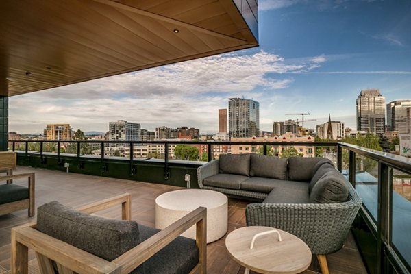 Relaxing outdoor patios with scenic views at Alta Peak Apartments, perfect for social gatherings and enjoying the luxury of Greystar living