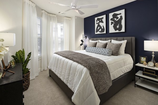 Elegant bedroom with modern decor at Alta Porter on Peachtree apartments