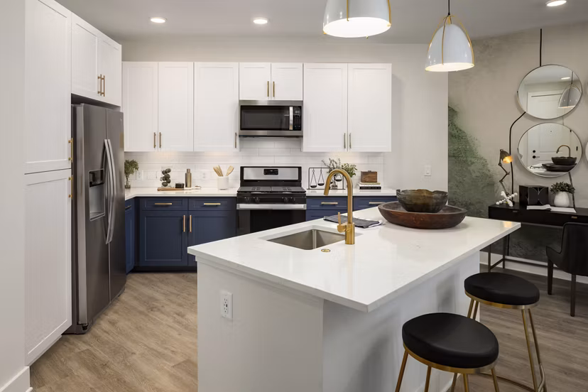 Modern kitchen with marble countertops and stainless steel appliances at Alta Porter on Peachtree luxury apartments