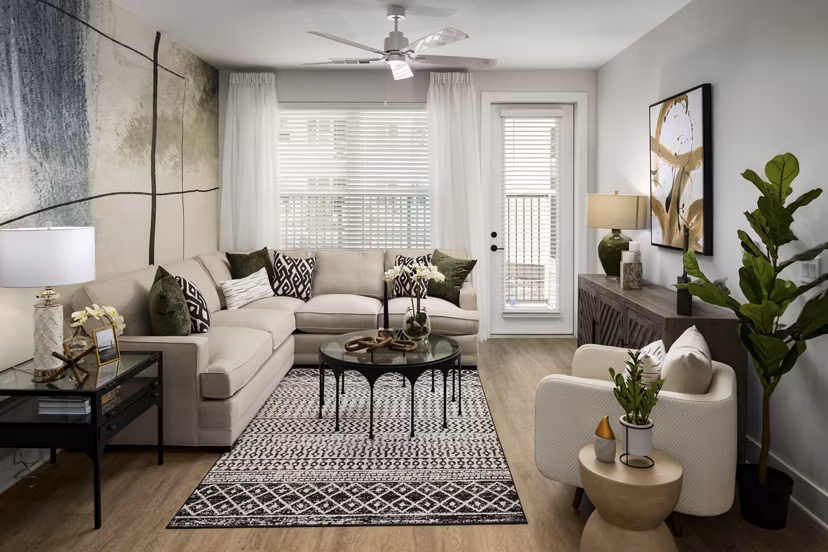 Spacious living room with modern decor and natural light at Alta Porter on Peachtree apartments