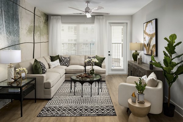 Spacious living room with modern decor and natural light at Alta Porter on Peachtree apartments