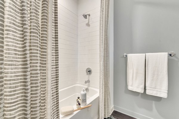 Modern bathroom featuring elegant fixtures at Alta Purl Apartments luxury residences