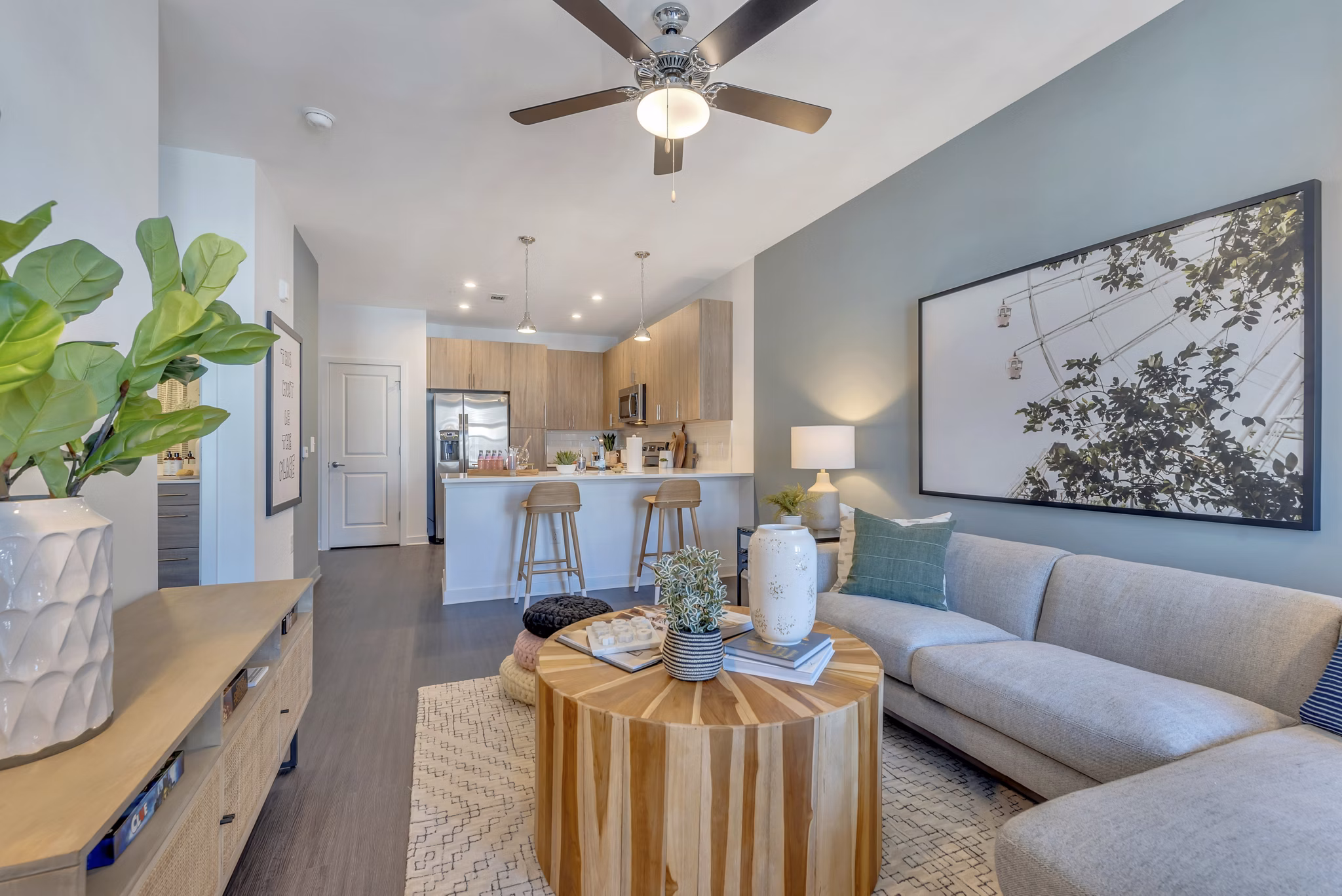 Spacious living room with modern furnishings at Alta Purl Apartments